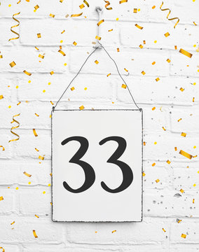 33 .thirty three years old birthday anniversary party congratulations card text with golden confetti