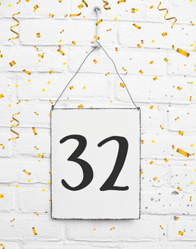 32 years old birthday anniversary party congratulations card text with golden confetti