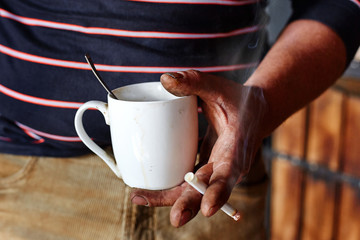 Man's den workshop inside talk with smoking and coffee