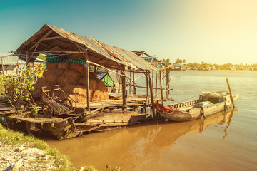 Fototapeta na wymiar old wooden shack on the Mekong river in Vietnam