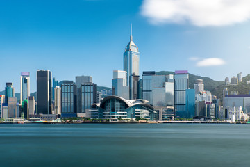  Hong kong city long exposure skyline business district on the sunny day with clear blue sky