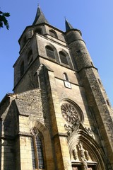 Fototapeta premium Bell tower with twisted roof of the church in the village Saint Côme d'Olt, Aveyron, France 