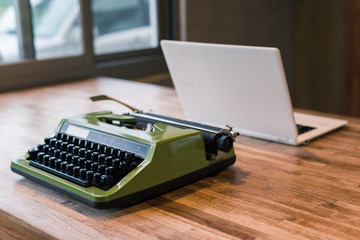 typewriter and laptop