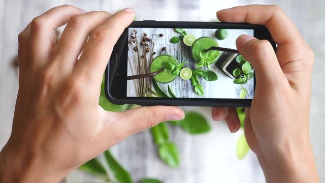Woman Taking Food Photo With Smartphone Camera. Taking Picture Of Healthy Detox Smoothies.