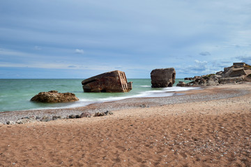Bunker ruins near the Baltic Sea beach, part of the old fortress in the former Soviet Union base "Karosta" in Liepaja, Latvia. Photographed in summer.