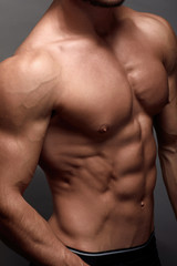 Fototapeta na wymiar Athletic Man Fitness Model Torso showing big muscles.