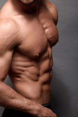 Fototapeta na wymiar Athletic Man Fitness Model Torso showing big muscles.