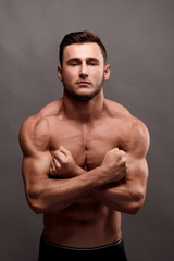 Fototapeta premium Athletic Man Fitness Model Torso showing big muscles.