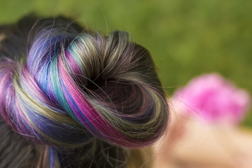 Naklejka premium Trendy hairstyle concept. Girl with colorful dyed hair.