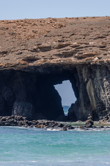 ocean landscape with arch of srone. Fuerteventura.