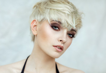 Beauty portrait of blond model in fashionable haircut