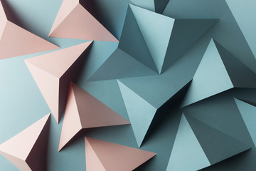 Composition with triangular shapes of paper, blue background