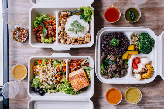 Clean food meal boxes: rice and rice berry with beef, salmon and chicken in various vegetables and salad for good health.