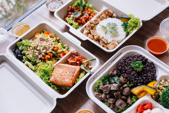 Clean food meal boxes: rice and rice berry with beef, salmon and chicken in various vegetables and salad for good health.