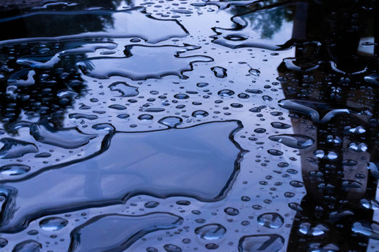 Water on a glass table after rain.