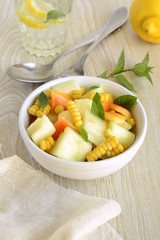 Salad with melon, corn and sweet pepper