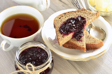 Wholegrain toast with blackcurrant jam and butter