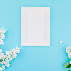 Blank frame mockup with white flowers