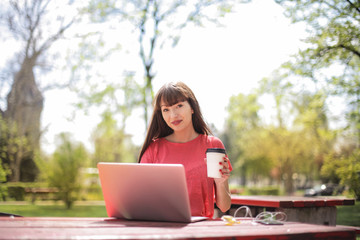 Working in the park with laptop