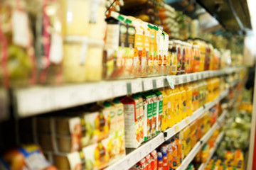 Shelves with different grocery products in the supermarket