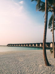 Maldives island luxury beach resort sunset