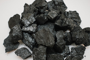 piles of charcoal isolated on white background, xylantrax, charcoal, top view. coal. brown
