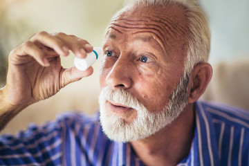 Elderly Person Using Eye Drops