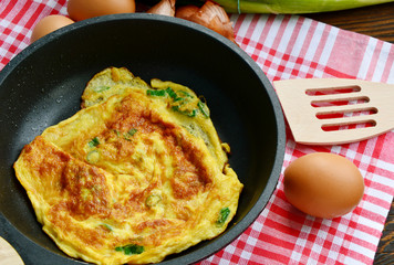 Scallion or Spring onions omelet Thai style  in wok (Thai name is Kai Jieow Tonhorm).
Famous and easy Thai food menu for all ages.
Eggs Thai menu.
