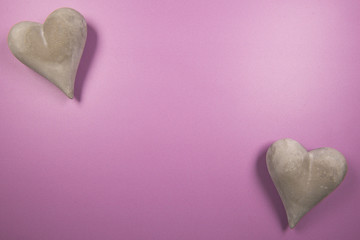 Pink background image of heart stones  with copy space 