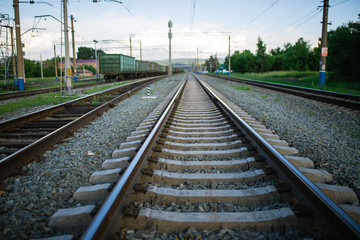 Fototapeta na wymiar rails stretching into the distance, railroad tracks, turn at the railroad
