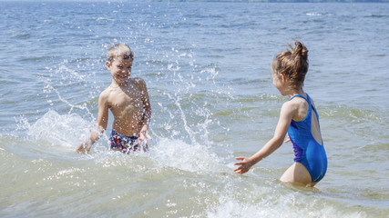 Children have fun playing on the seashore