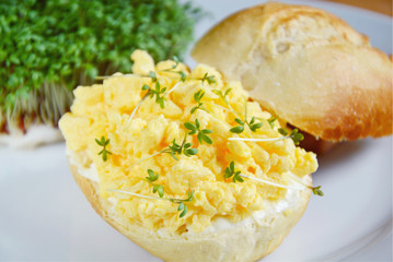 Easy  healthy breakfast children menu with scrambled eggs,cream cheese and Garden cress.