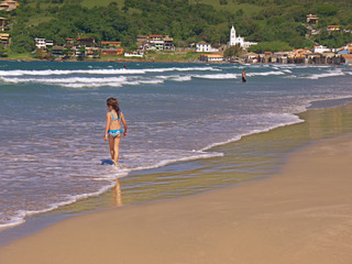 The beautiful beach at the small coastal town of Garopaba on a perfect sunny day.