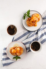 Cottage cheese pancakes, syrniki, curd fritters. Breakfast with coffee, cheesecake and apricot jam. Flatlay. Top view. copyspace