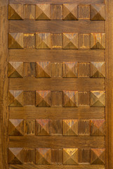 Background. The texture of the old wooden. Typical medieval Castilian door. Spain.