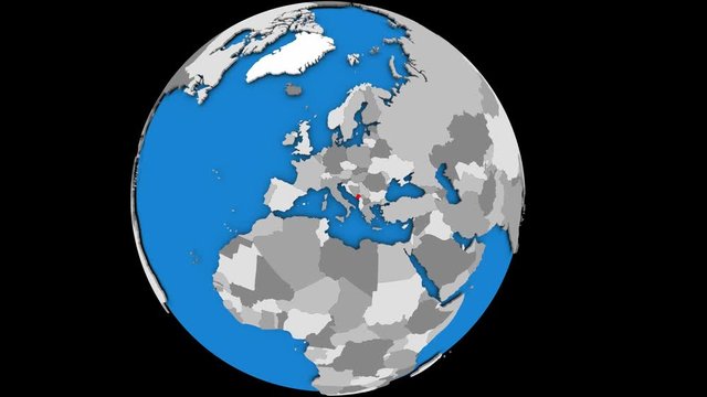 Montenegro coming forward towards camera on gently rotating political globe. 3D animation.