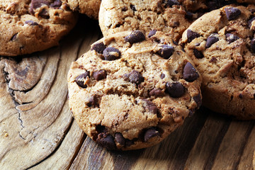 Chocolate cookies on table. Chocolate chip cookies shot with chocolate