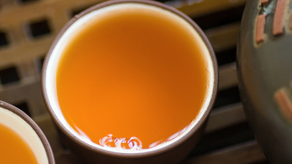 Details Close Up of Set of Chinese Japanese Tea Cups Pot Bowls on Bamboo Wooden Tray. Freshly Brewed Beverage. Preparing Ceremony. Tranquility Balance Wellness. Poster Banner with Copy Space
