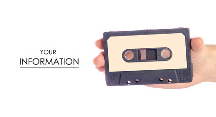 Fototapeta premium Audio cassette in hand stereo music pattern on white background isolation