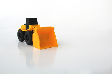 Obraz premium A Toy wheel loader on an isolated white background 5