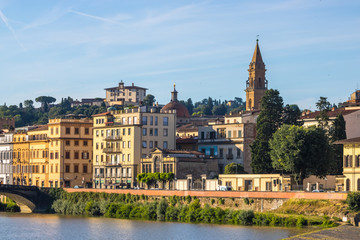 Naklejka premium Colorful old buildings line the Arno River in Florence, Italy