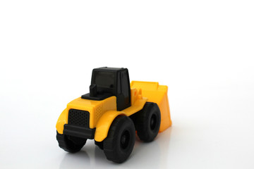 A Toy wheel loader on an isolated white background 9
