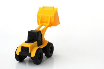 A Toy wheel loader on an isolated white background 11