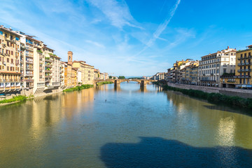 Colorful old buildings line the Arno River in Florence, Italy