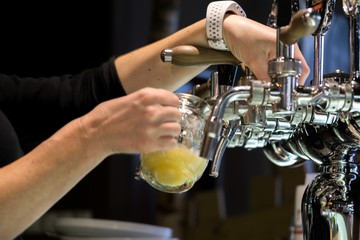 Fototapeta na wymiar Beer taps in the pub. Zilina, Slovakia