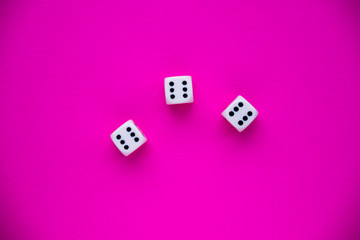 dice on a magenta background