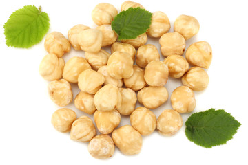 hazelnuts with leaves isolated on white background. top view