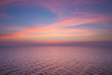 Sunset and sea. Waves and nature. Orange sky.