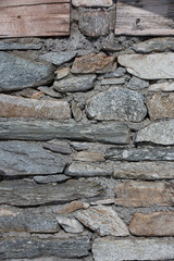 Fragment of  wall of  old building in abandoned mountains village