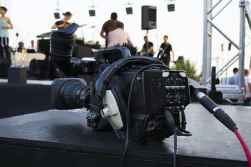 Fototapeta na wymiar Professional digital video camera. accessories for 4k video cameras. tv camera in a concert hall.